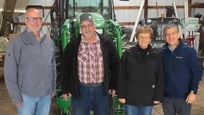 Ted Dabrowski pictured with farmers from the Macon County Farm Bureau