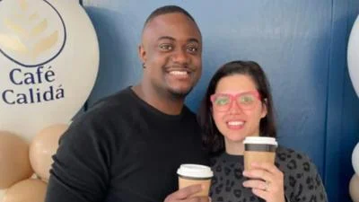 Anton Adkins, Press Aide in the Office of the Mayor (left) and wife, Liset (right)