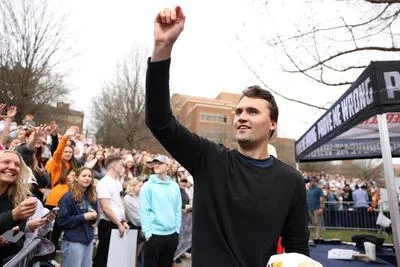 Charlie Kirk speaks with attendees at the University of Tennessee, Knoxville, during the "American Comeback Tour" at the HSS Lawn Amphitheater in March 2025. He was later assassinated at a similar event on September 10, 2025.