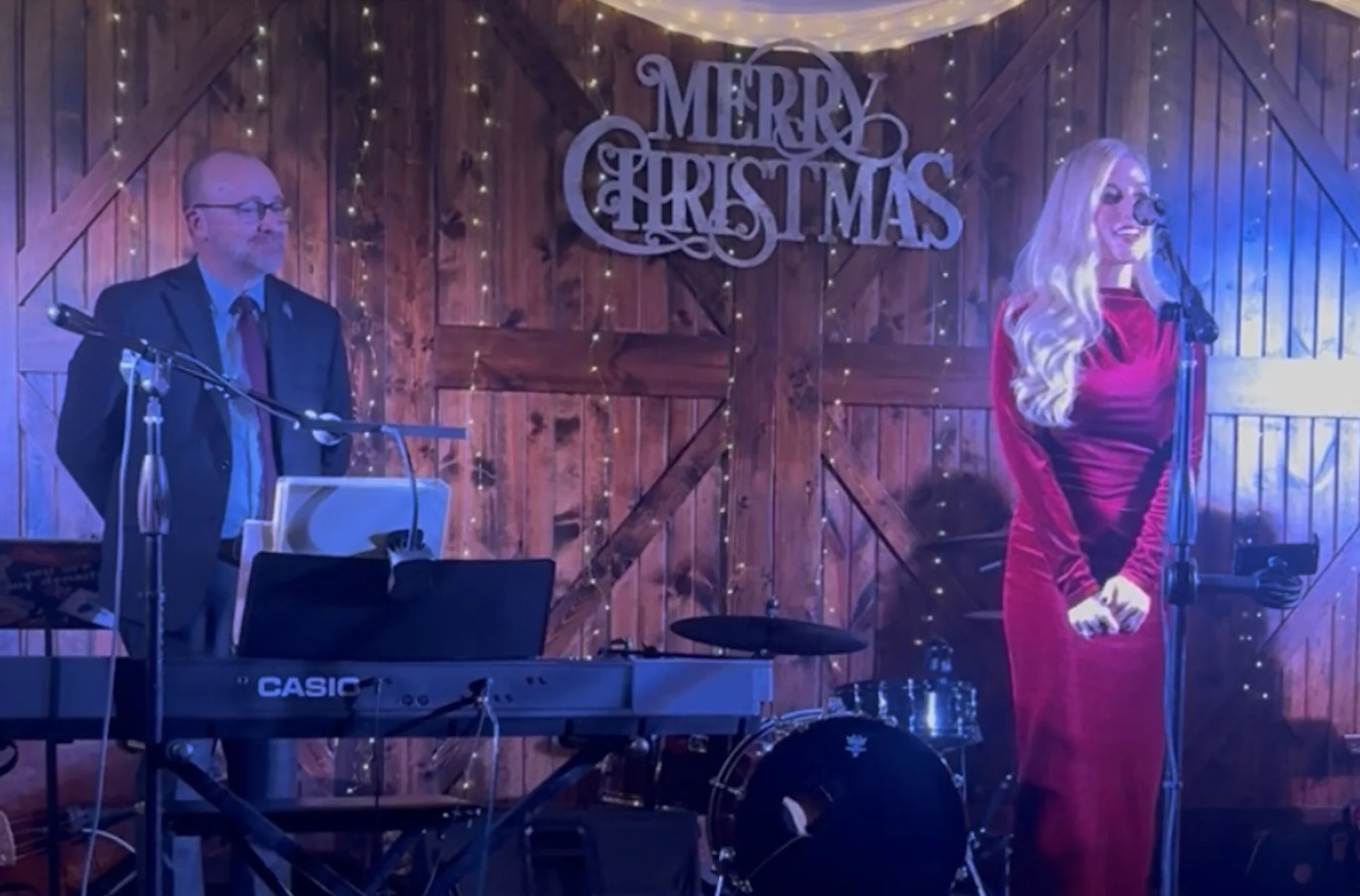 State Rep. Jed Davis (left) and Kristina McCloy (right) speak at Davis’s Whitetail Christmas gala, calling for statewide funding for school resource officers.
