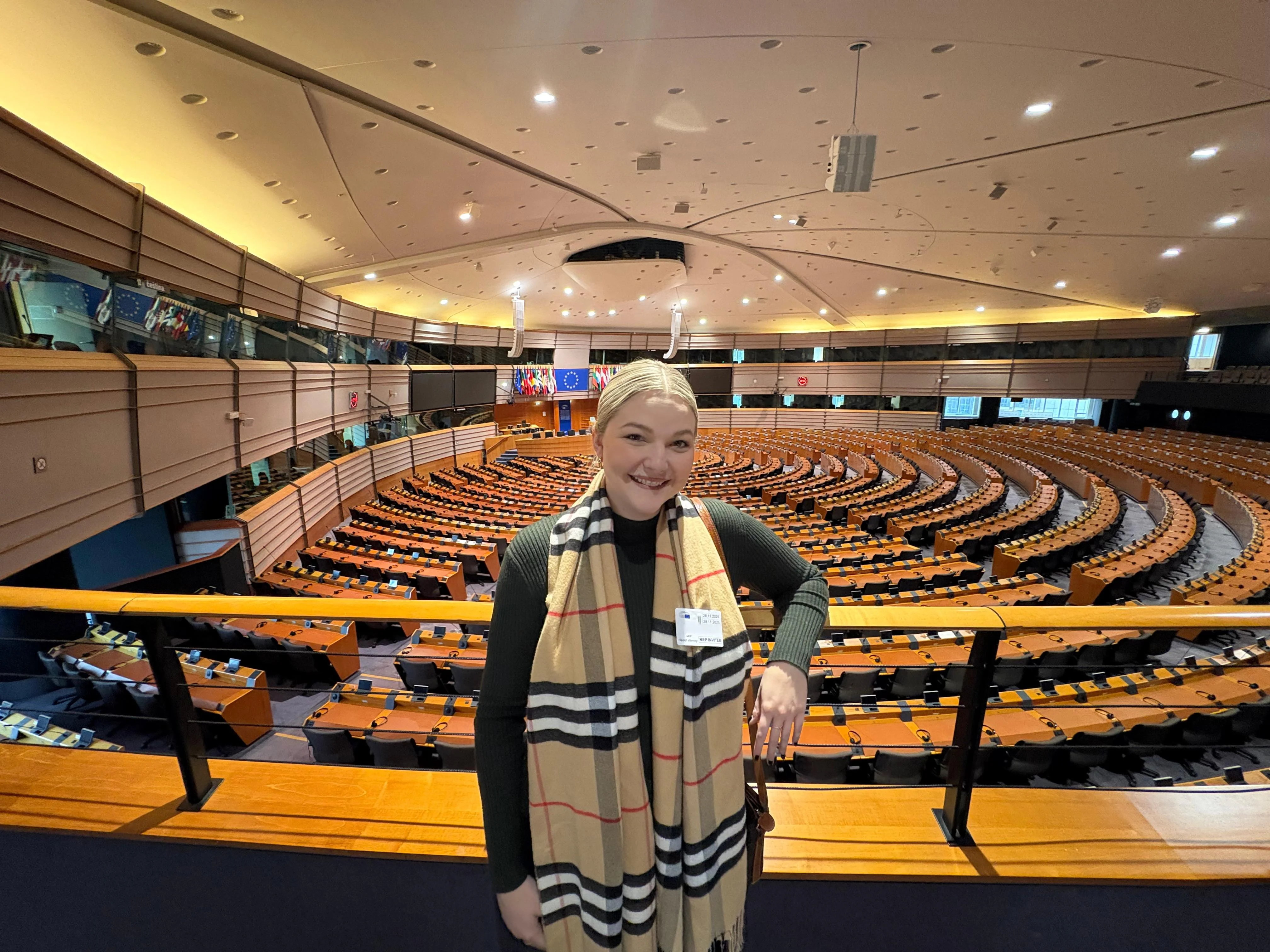 Ashley Dalton, chair of the Chicago Young Republicans, stands inside the European Parliament in Brussels, highlighting the organization’s growing international connections and influence.