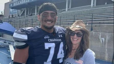 Carrie Mendoza pictured with her son Jesse who plays center for the Hillsdale Chargers