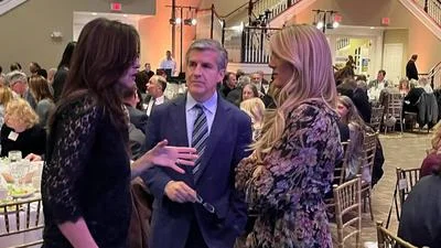 Ted Dabrowski and Carrie Mendoza pictured talking to women's rights champion Riley Gaines