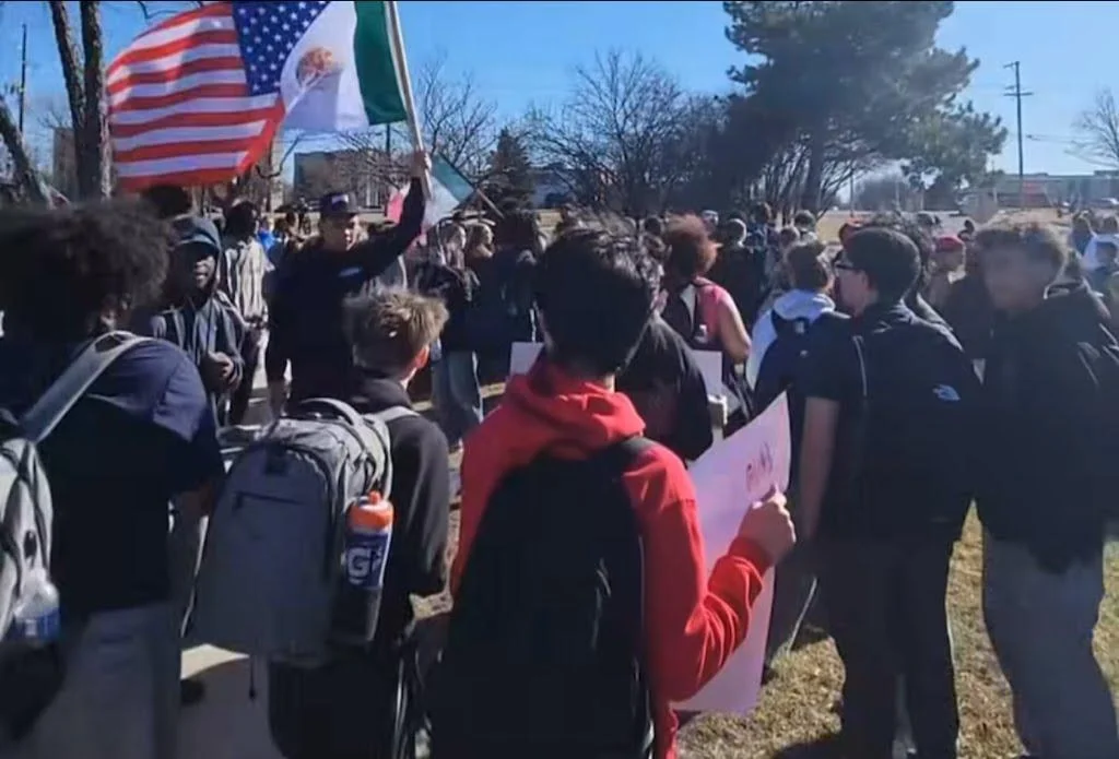 A sewn-together American and Mexican flag stood out above the crowd during the Hinsdale Central walkout.